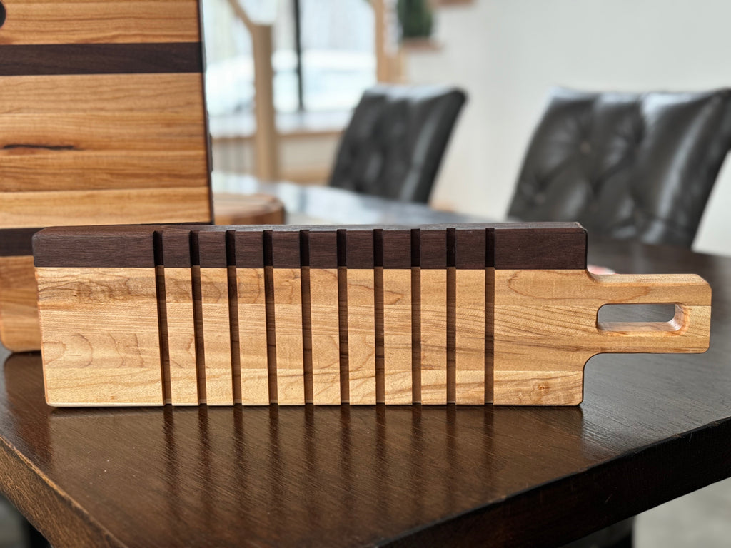 walnut and maple breadboard with slicing grooves, can be personalized.