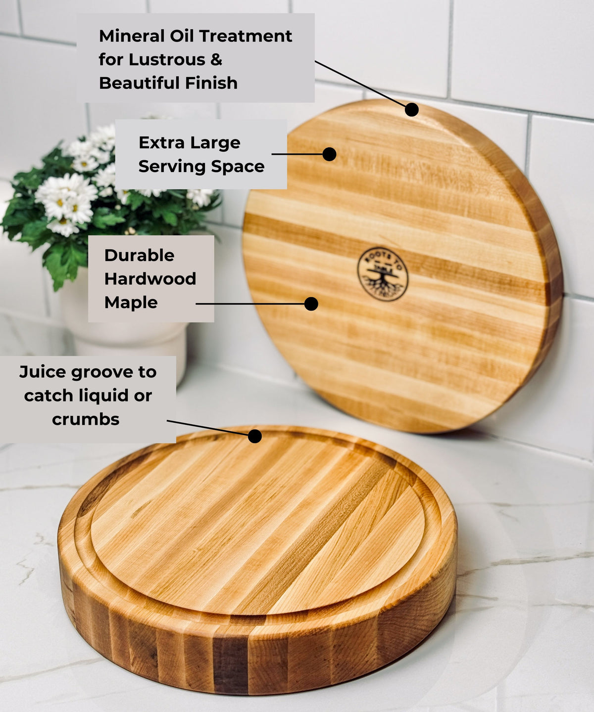 Two round maple wood cutting boards with a smooth mineral oil finish, one featuring a juice groove for catching liquids. The boards showcase durable hardwood maple grain and offer extra-large serving space. The back of the board has a company logo branded in the center of the board.