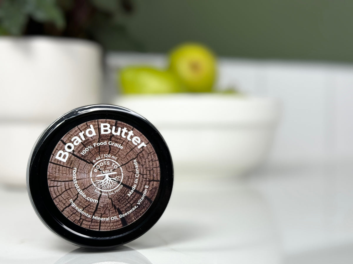 A tin of Board Butter by Roots To Table