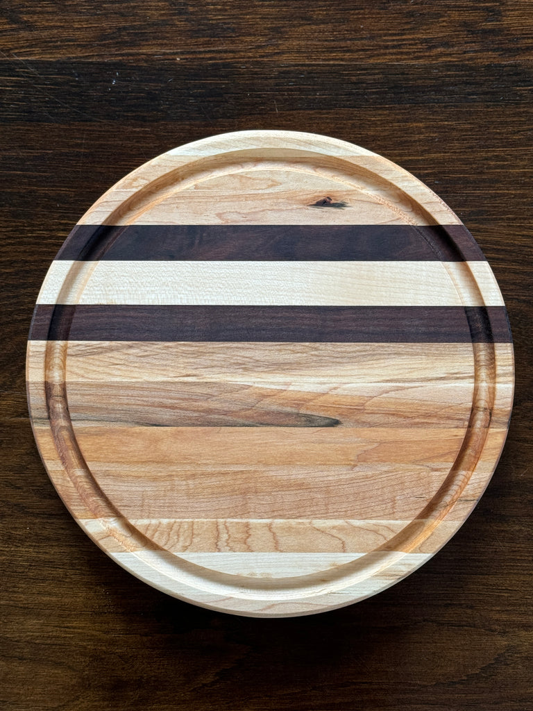 The Round 12x12 Edge Grain Maple & Walnut Accent Cutting Board