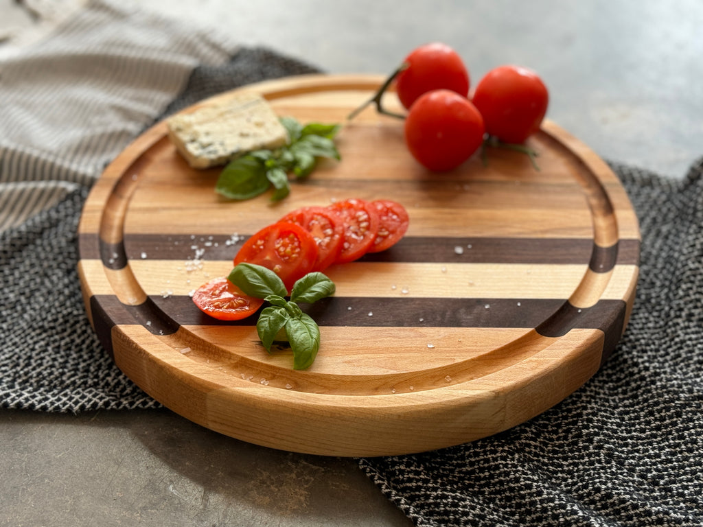 The Round 12x12 Edge Grain Maple & Walnut Accent Cutting Board