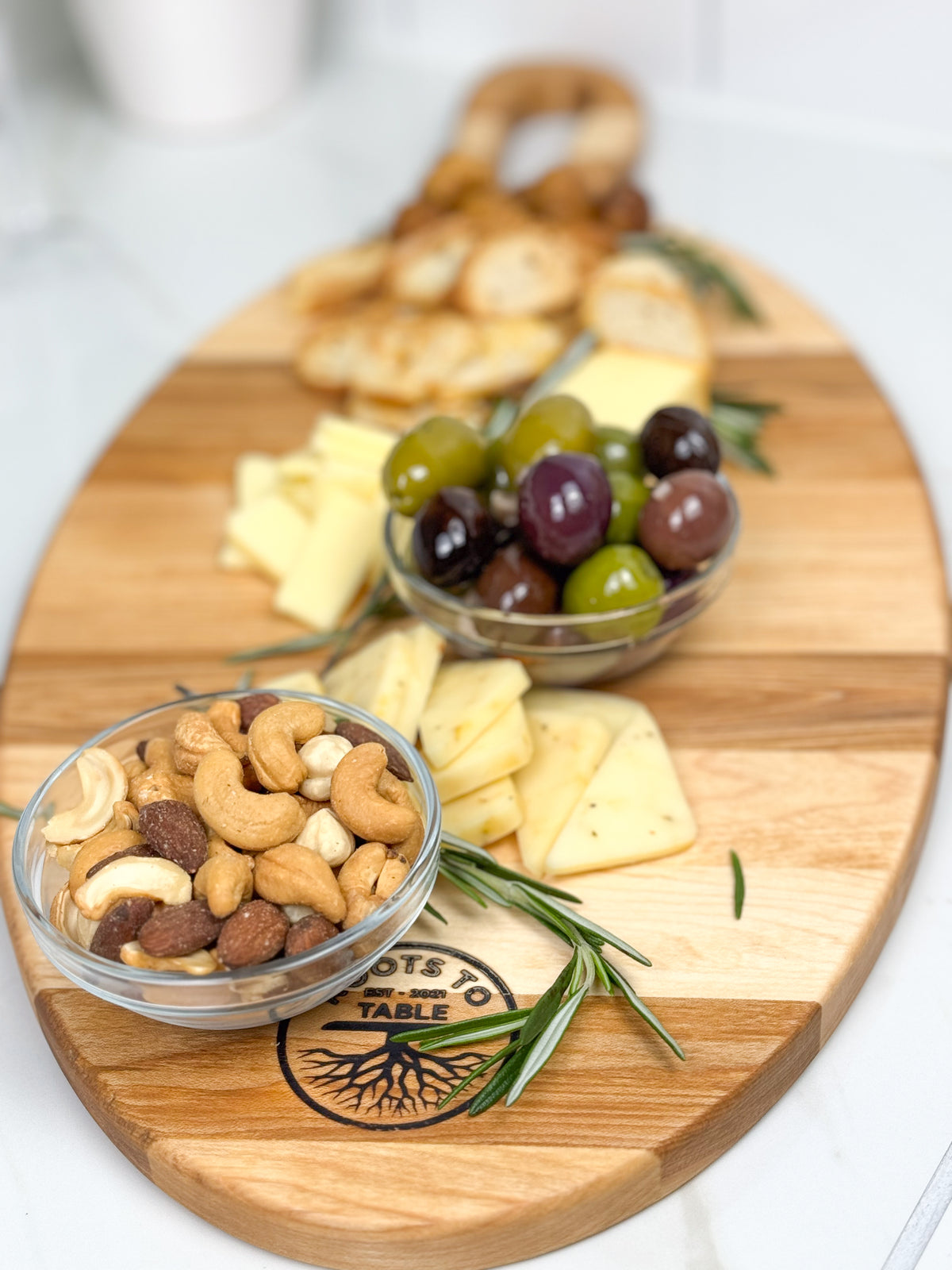 Edge Grain Oval maple charcuterie board with a smooth finish, showcasing rustic beauty and design.