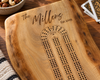 A personalized live-edge maple wooden cribbage board set engraved with 'The Millers Est 2005.