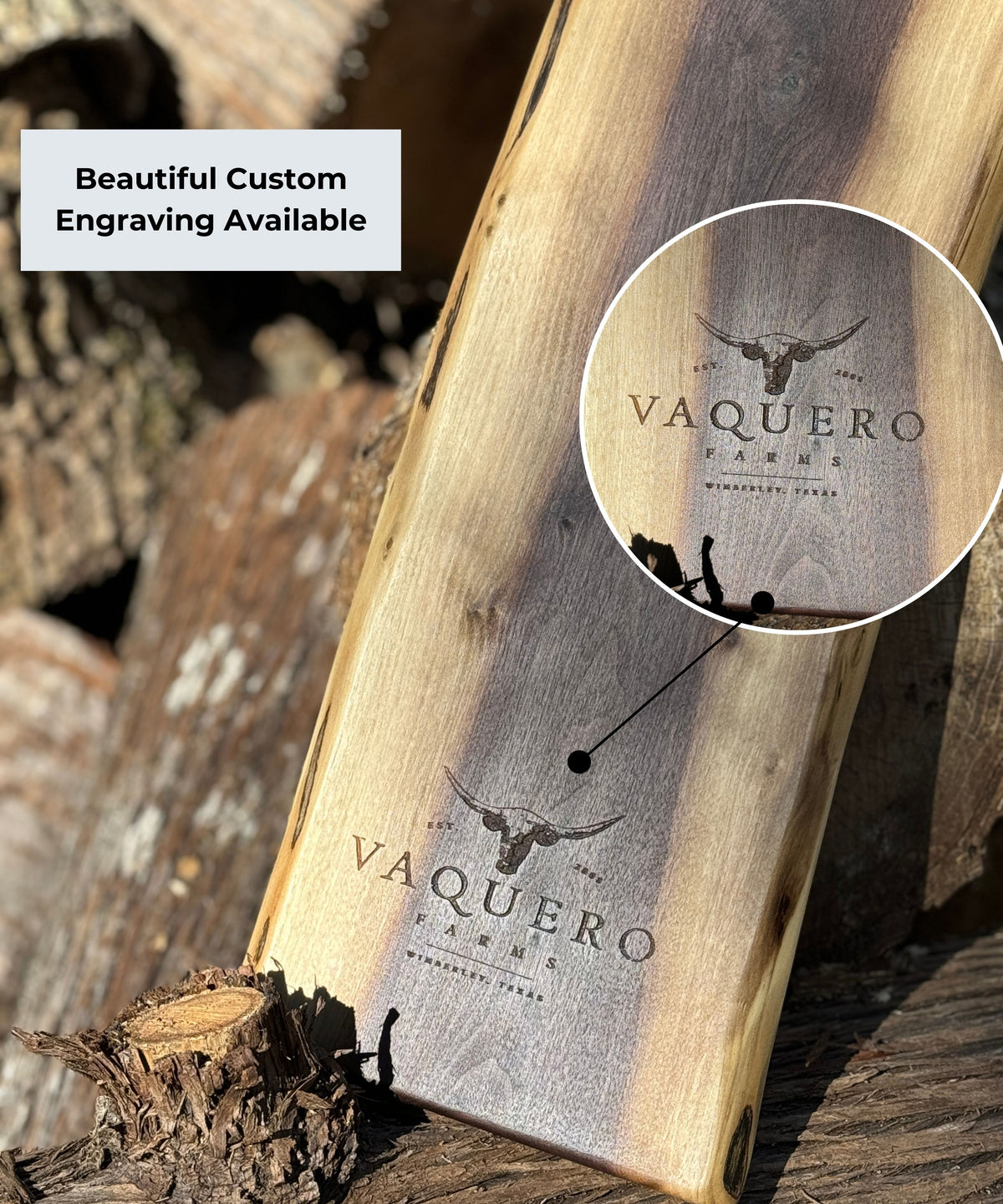Black Walnut charcuterie board with rich ark tones down the centre of the board and light creamy tones on the outer live edges. It highlights a custom engraving of a bull's head and the name Vaquero Farms 