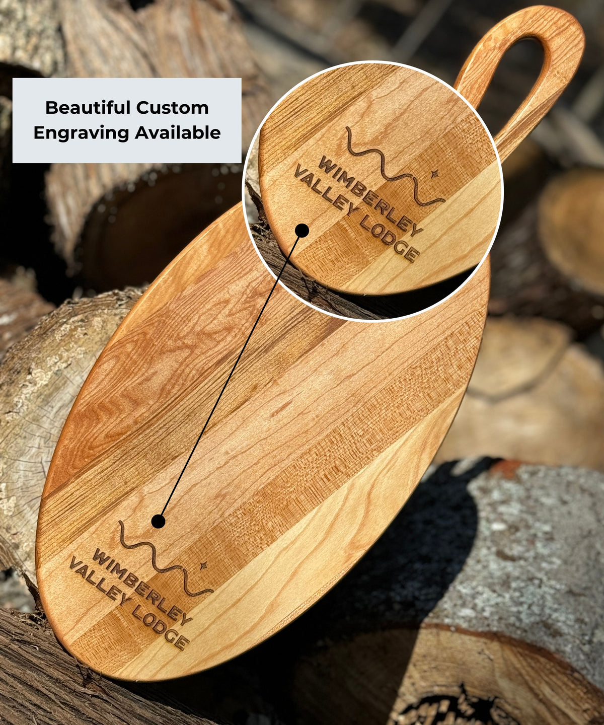 24 Inch Oval edge grain maple wood charcuterie board with a handle, featuring engraved customization Highlighting custom engraving.