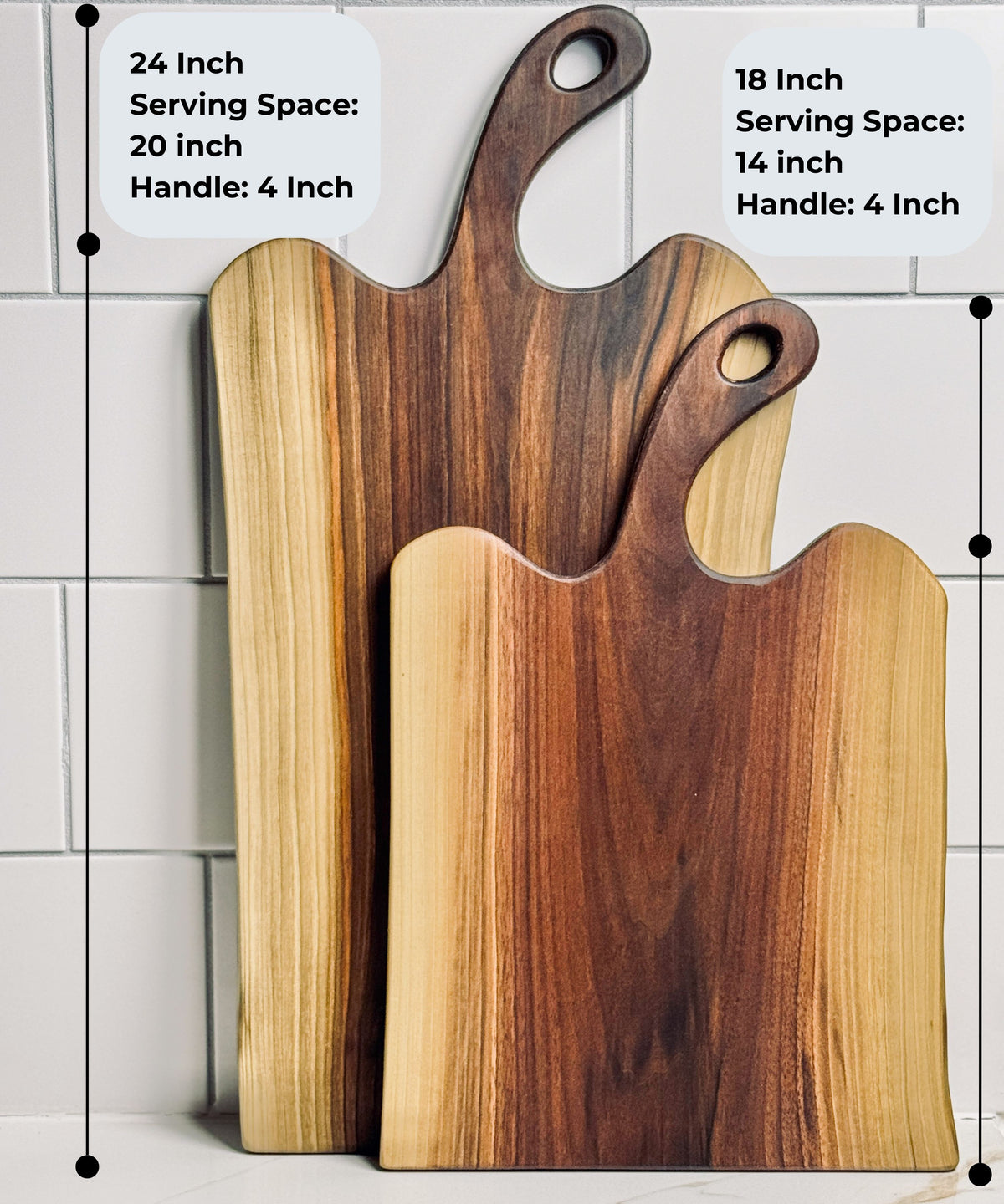Black Walnut charcuterie board with handles, the 24 inch cheese board has 20 inches of serving space and the 18 inch has 14 inches of serving space.