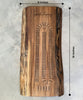A handcrafted wooden walnut cribbage board measuring 16x6 inches, featuring a natural live-edge design. The board is personalized with The Smith Family, Est. 1987, engraving, combining functionality and rustic elegance for family game nights.