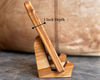 An infographic showing the handwritten recipe board side profile, 1 in thick. The board rests on a wooden book stand.