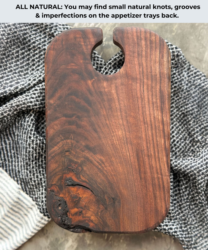 Back view of a dark walnut appetizer tray featuring natural knots, grooves, and imperfections, showcasing the unique and rustic character of the handcrafted wood piece