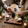 Couple holding personalized nesting charcuterie board gift set for weddings, engagements, and anniversaries