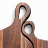Close-up detail of interlocking handle design on personalized nesting charcuterie board set