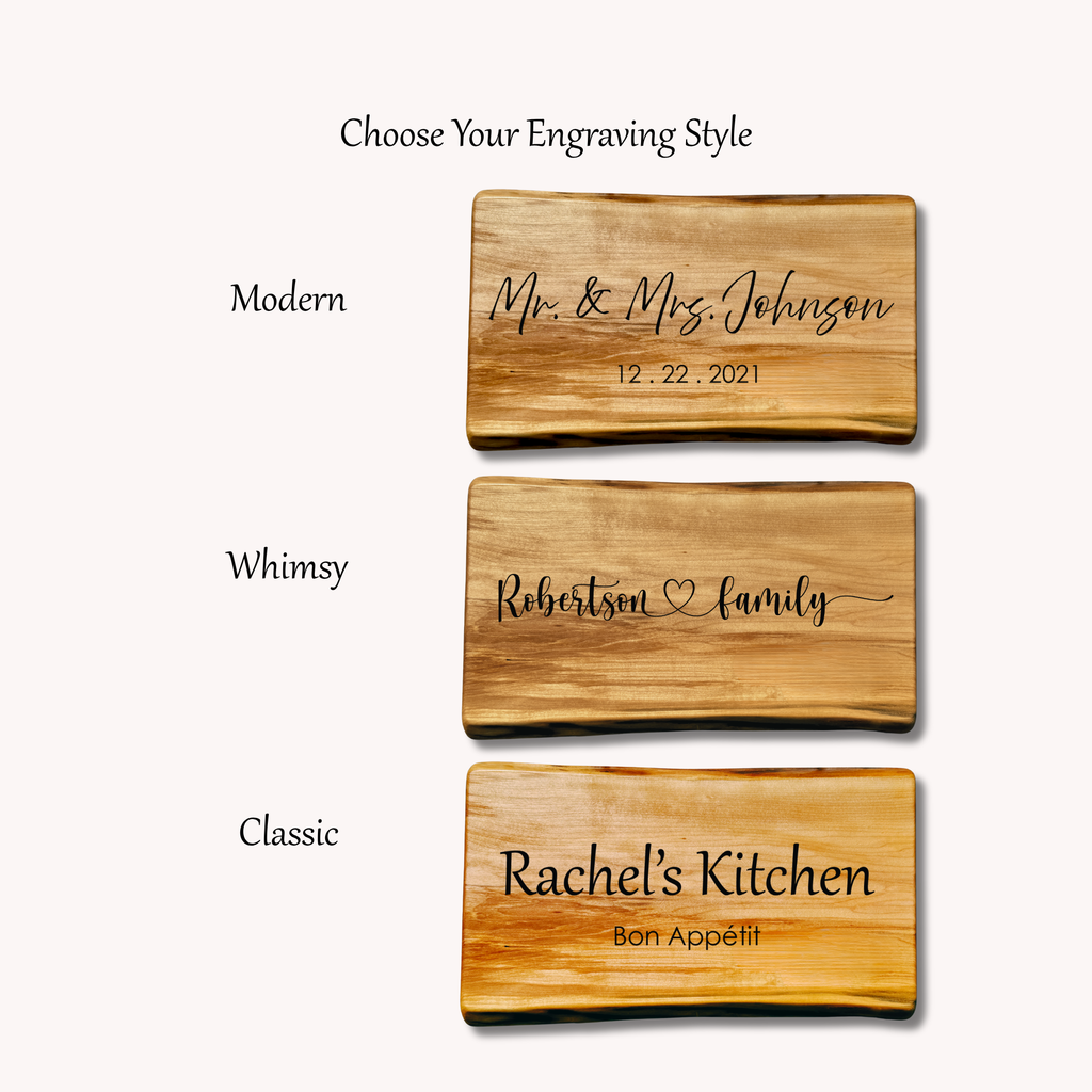 Three wooden cutting boards with engraved text and different styles available for personalization.