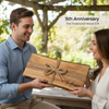 perfect traditional 5th anniversary wedding gift is wood, here is a wooden personalized live edge charcuterie board being gifted from husband to wife.