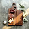 Personalized nesting cheese board with engraved couple names styled with charcuterie and fresh fruit, made for anniversary gifts