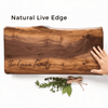 Top view of personalized walnut live edge charcuterie board showing natural shape and wood grain with custom engraving
