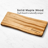 Solid maple wood cutting board with 'Pendergrast' engraving on a white background